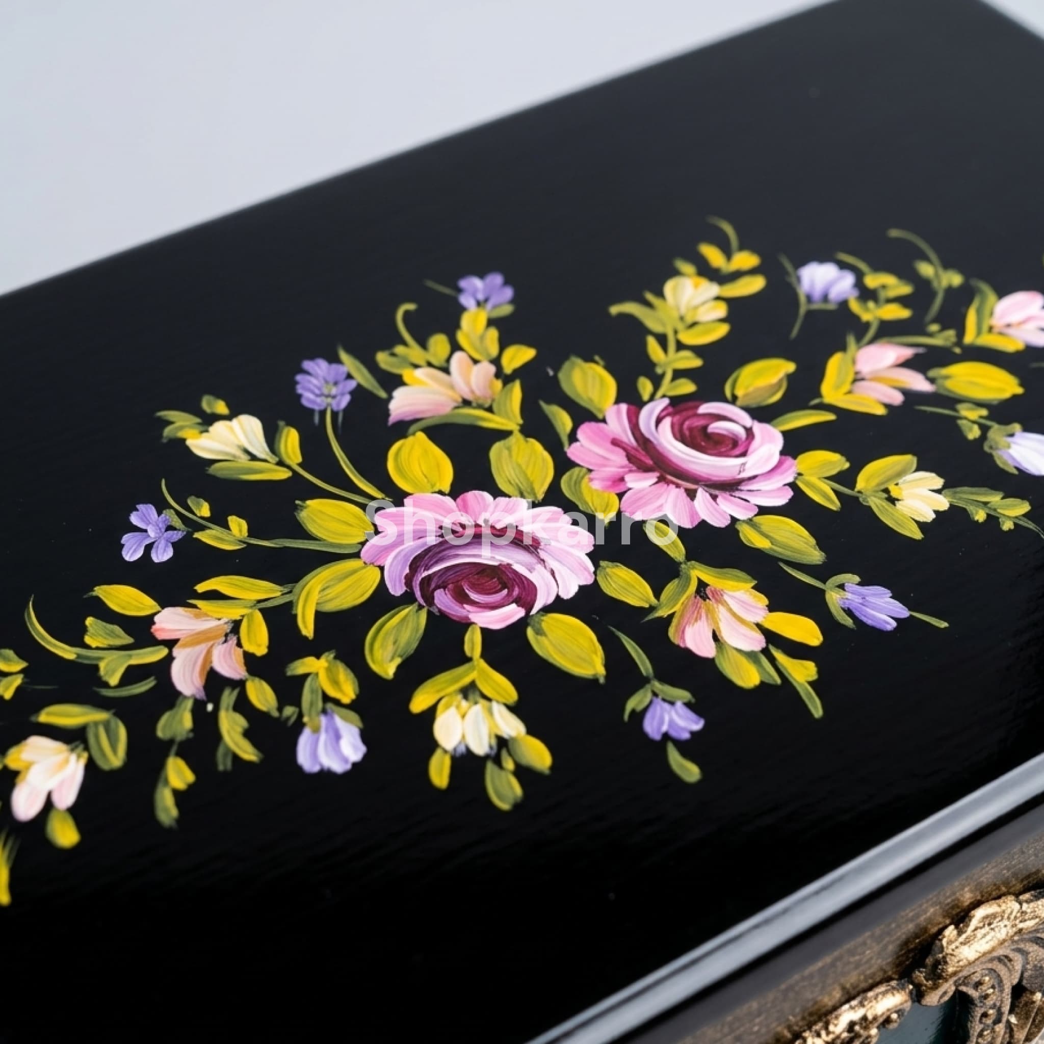 "Hand-painted floral details on Majestic Floral Namaz Box - Close-up of golden and colorful embroidery on black prayer storage box"