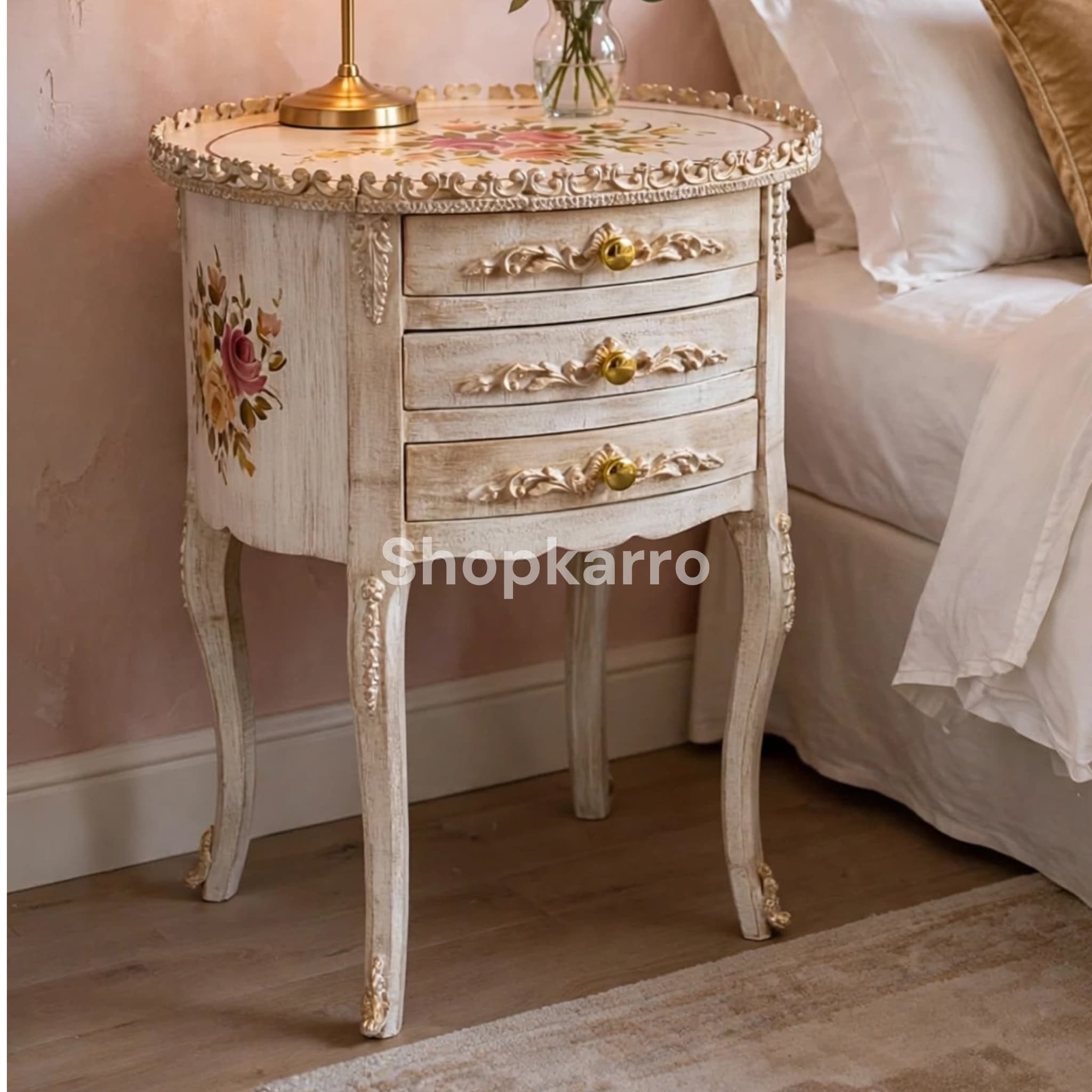 Antique Rose Wooden Table as bedside piece in romantic blush pink bedroom with gold chandelier