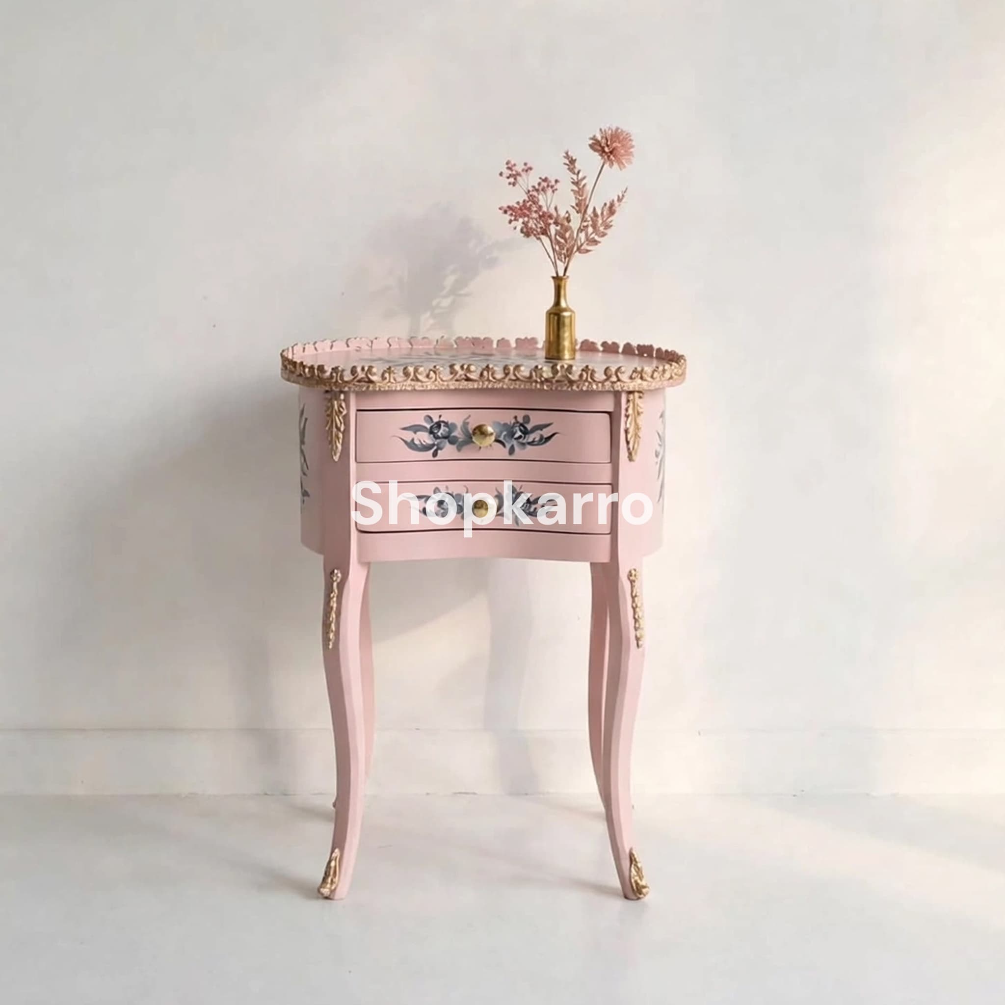 	Front view of Pink Flora Wooden Table showing scalloped edge, grey floral drawers and gold claw feet