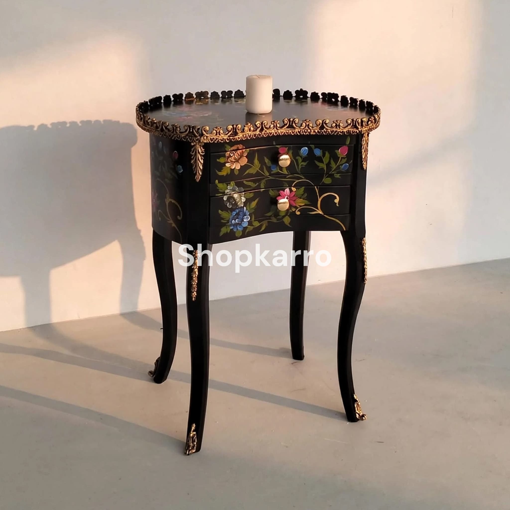 Daisy Pearl Wooden Table against clean white wall creating striking dark colorful contrast