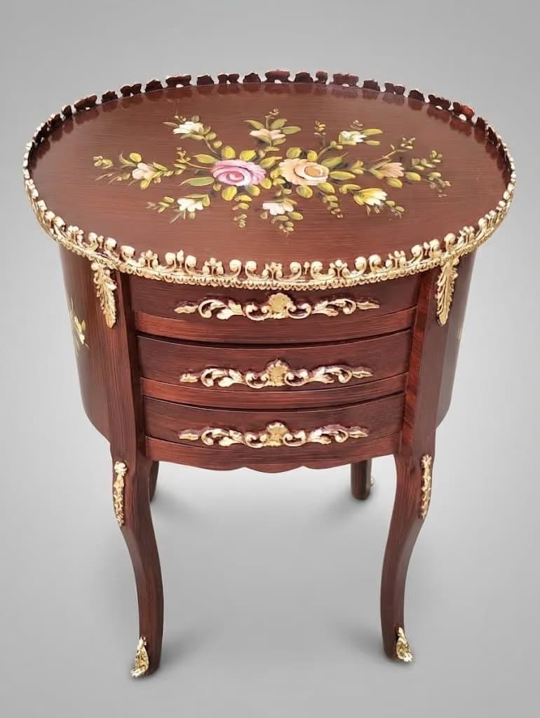 Close-up of hand-painted floral design on mahogany wooden table