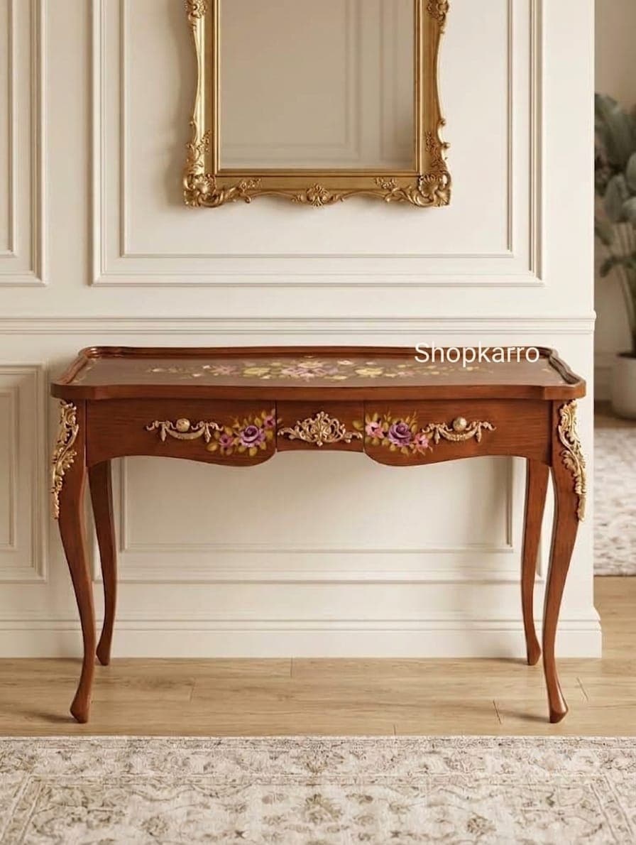 Brown wooden console table with floral inlay design, ornate gold detailing, curved legs, and three drawers.